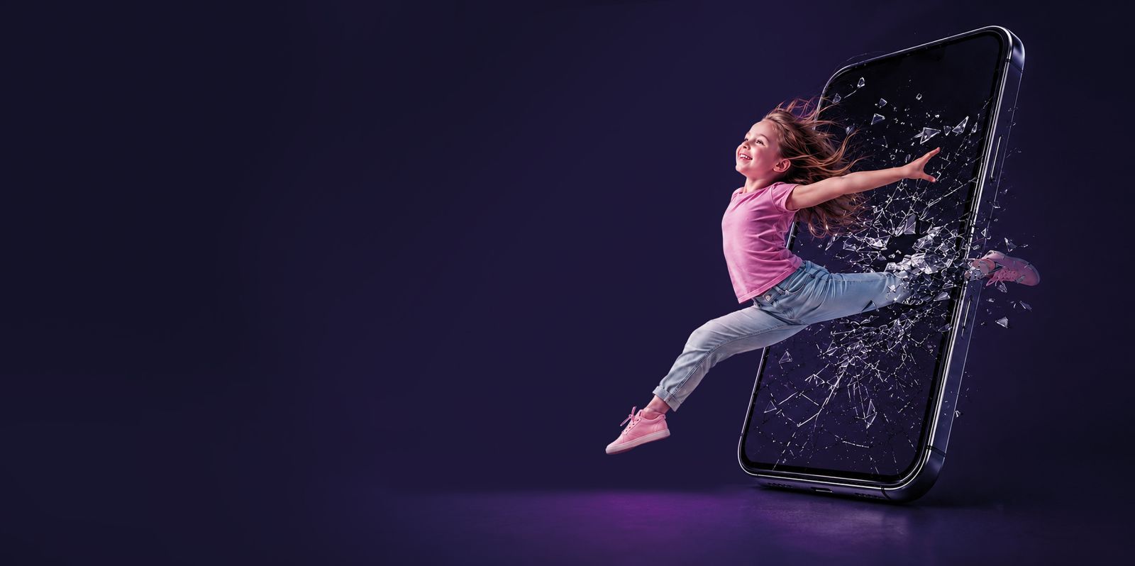 A girl in pink bursts out of a giant smartphone screen, shattering the glass — Irpin Dance Centre